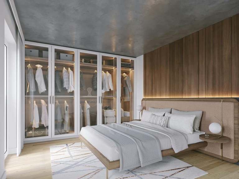 Walk-in dressing sur mesure SCARS dans chambre parentale, façade bois et tête de lit intégrée.
